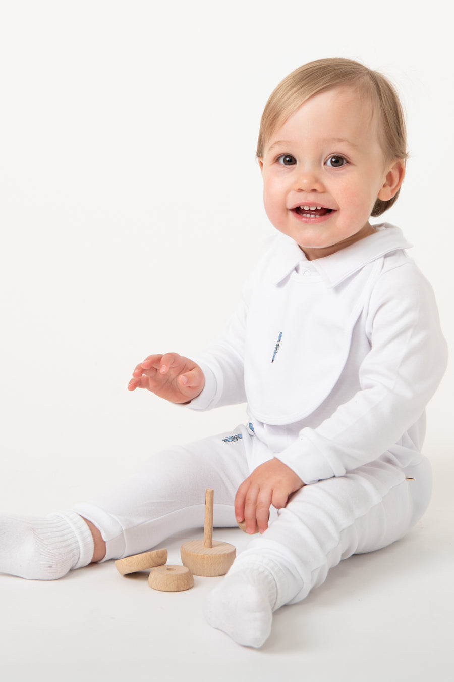 White Baby Romper with Embroidered Soldiers and Matching Bib